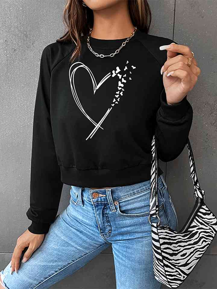 Sudadera con estampado de corazón y manga raglán con cuello redondo